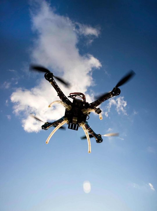 drone-in-flight-with-cloudy-sky-PTCUKNJ-scaled.jpg